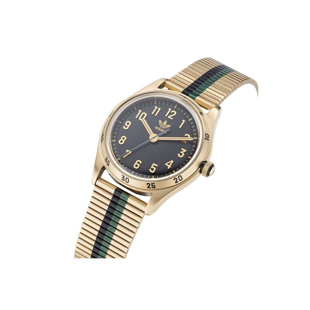 Gold watch with black face and green accents on a white background