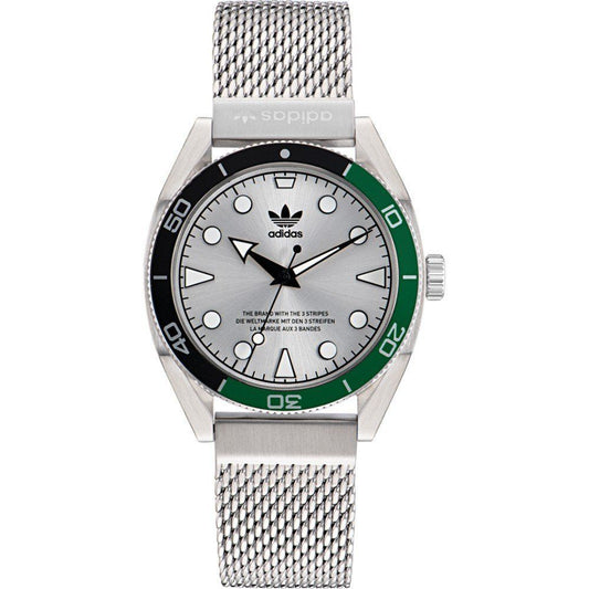 Adidas watch with silver mesh band and green bezel on a white background