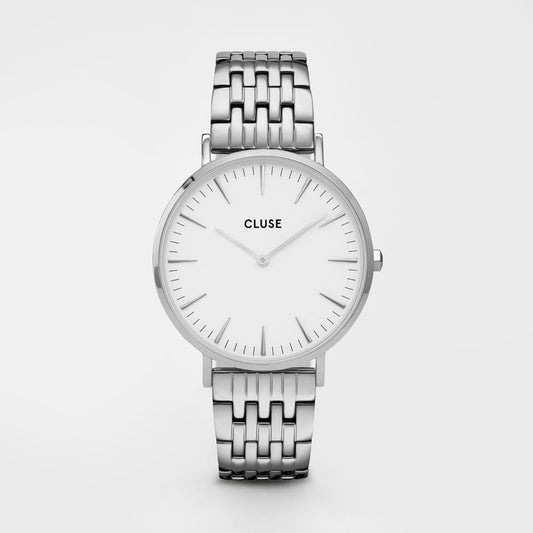 Silver watch with a white face on a light gray background