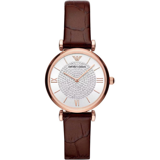 A stainless steel Emporio Armani watch with a polished rose gold finish and a bordeaux leather strap. The watch face is white with Roman numerals and the brand's logo at 10 o'clock.